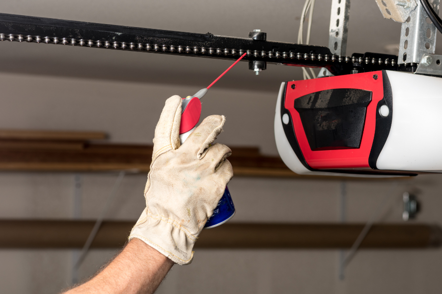 Lubricating chain drive garage door opener